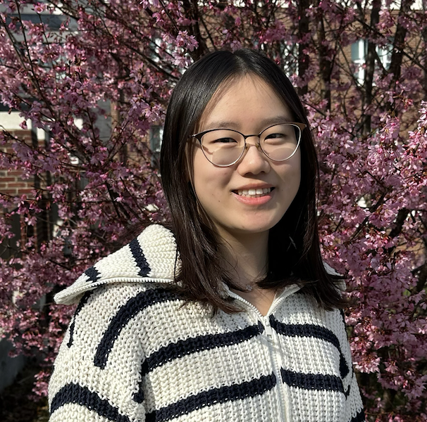 Woman around 20 years of age, smiling